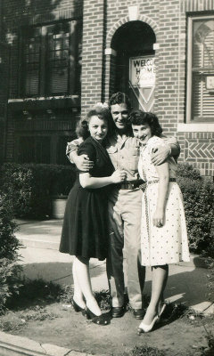 Mom and Alice welcome dad home.jpg