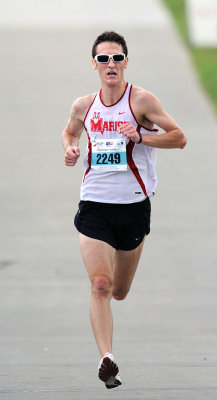 Matthew Szymaszek finished fourth in 16:26 