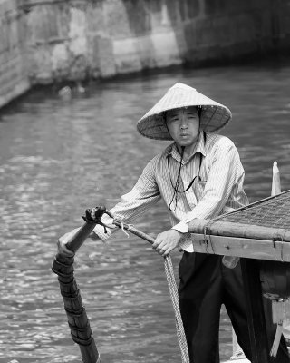 Boatman in the Chineese Water Village of Zhujiajiao