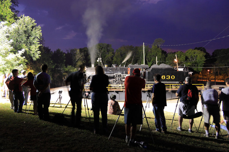 A line of photographers hard at work with a Southern  lady 