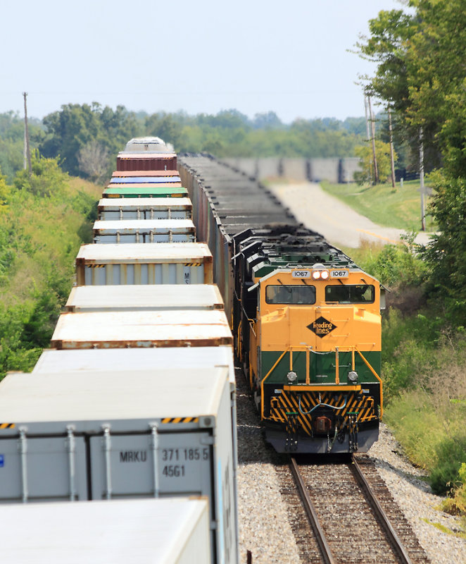 Stacks on the main, coal in the hole. Train 23G passes 77J at Waddy 