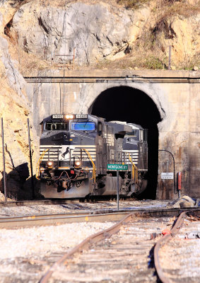 A Westbound coal train emerges from the tunnel 