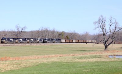Southbound coal train 792 passes a crewless 167, tied down on #2 track at Bowen 