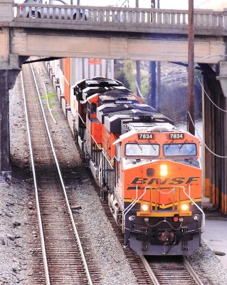BNSF power leads a CSX stack train through downtown Birmingham 
