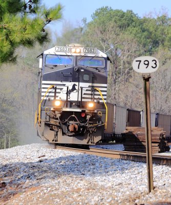 The sand is flying as NS 7683 drags a coal train up the hill into Irondale 