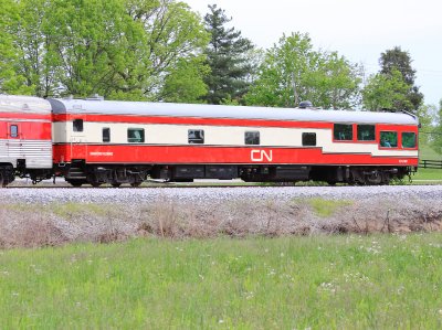 A CN theater car brings up the rear of the Corman Derby train 