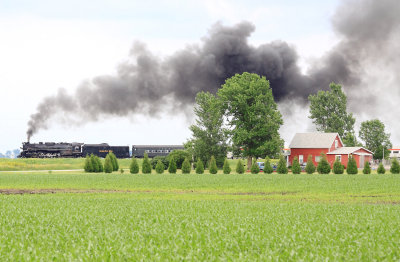 Northbound Nickel Plate steam passes a well kept homestead