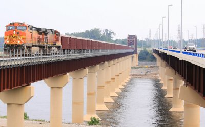 A BNSF ballast train, being handled by the Paducah & Louisville RR, crosses the nw bridge over KY lake