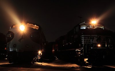The past and present of diesel power, side by side in the heavy night air. 