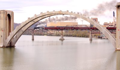 Southern Railway 154, framed by  the arch of the Henley Street bridge as she crosses the TN River 
