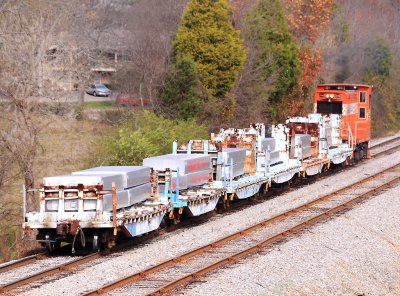 ALCOA transfer train with a orange critter on the head end 