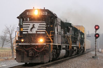 The snow is starting to fly as NS 223 rolls through Bowen 