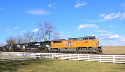 New UP power leads NS 704 at Vanarsdale