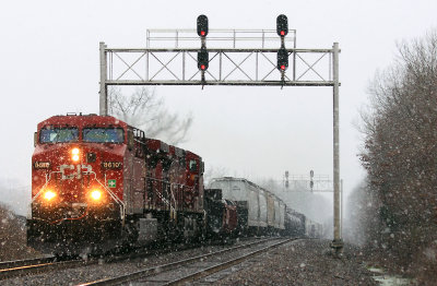 The snow is starting to fly as NS 142 rolls through the plant at Gradison 