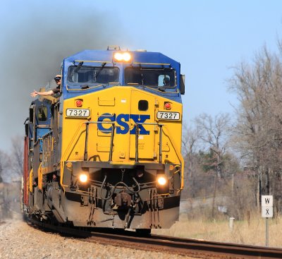A former Conrail GE leads Q-645 out of Sebree with a big wave from the throttle jockey 