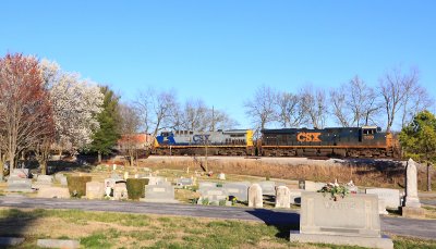 The sun is almost gone as Q-597 passes the Riverside Cemetery at Hopkinsville 