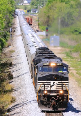 Eastbound 048 picks up speed as they leave the street running in Harrodsburg behind them 