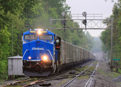 CR heritage unit 8098 leads NS 264 North through a cold rain at Junction City  