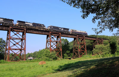 NS 50A is making a run for the steep grade up Kings Mountain as they cross the Green River Bridge at Southfork. 