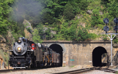 SR 630 roars out of the West portal of Montgomery tunnel on a 100 degree afternoon 