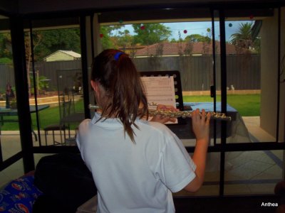 Playing Jingle Bells!  My talented little girl loves the flute I gave her!