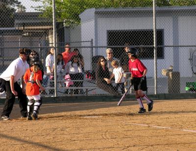 Lauren dives away from an inside pitch