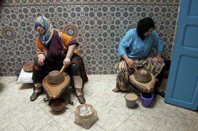 Women grinding Argan fruit