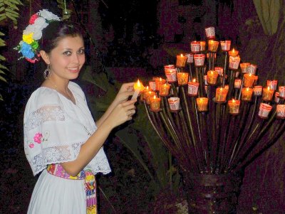 woman litghting candles