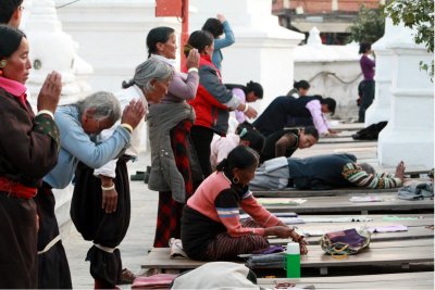 Tibetans prostrating at temple