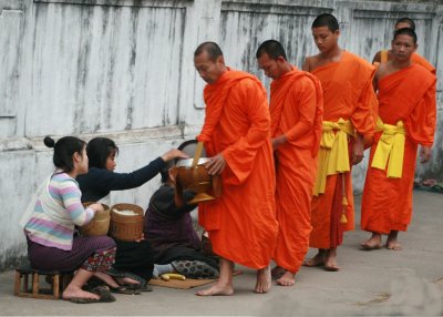 monks accepting offerings