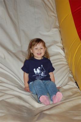 Rory sliding down the big slide