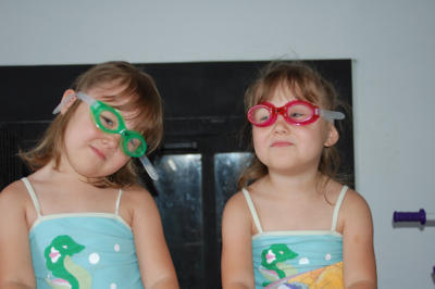 Practicing with our new googles before swim lessons (Reagan on left)
