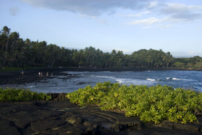 Black sand beach on the southern shore
