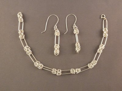 Finer chain bracelet with matching earrings.  Bracelet is approx. 9 inches in length.