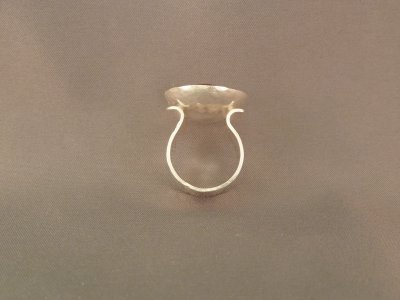 Side view of orange garnet ring.