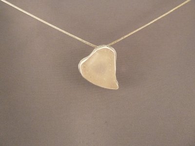 small white beach glass heart.  SOLD