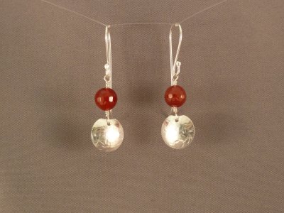 Carnelian beads with textured sterling dangles.