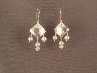 Fresh water pearls and moonstone beads dangle from a textured sterling square.