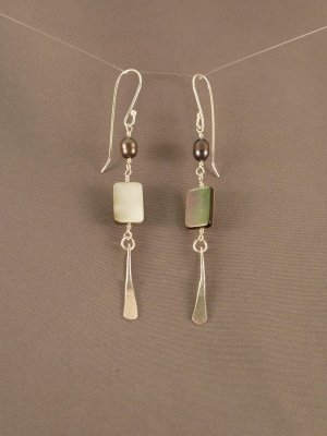 Fresh water pearls and mother-of-pearl with a hammered dangle.  The mother-of-pearl bead is black on one side and white on the other - you can turn them for a different look.