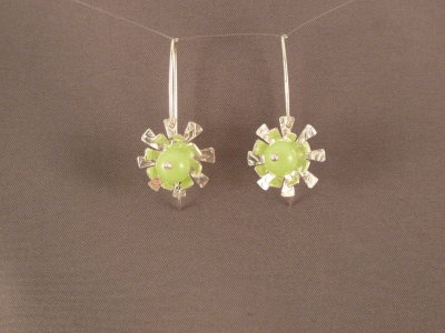 Funky flower earrings with a pale green glass bead at the centre.