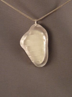 White ribbed beach glass set in sterling silver. Sold