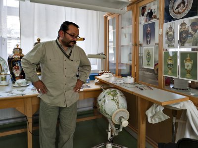 Master painter surrounded by his masterworks