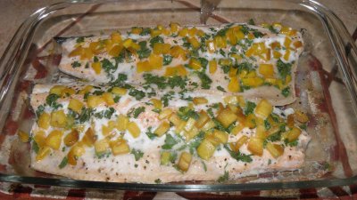 Trout fillets oven roasted with mango and cilantro