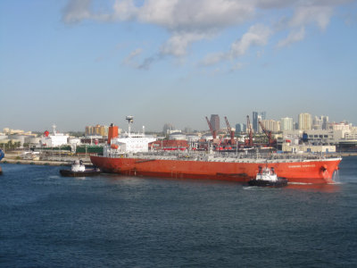 Tugs pulling a ship into port - sideways!