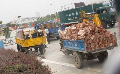 A ton of bricks and a tow truck