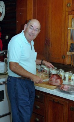 Ted carves the ham