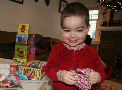 Henry's favorite thing to rip - holiday tissue paper from Jessy!