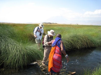 Crossing creek with Masai guid.jpg