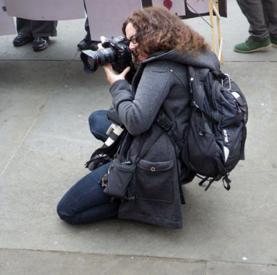 Squatting Photographer