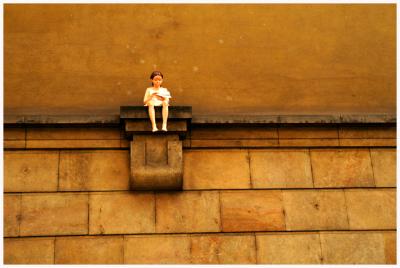 The doll on the wall.